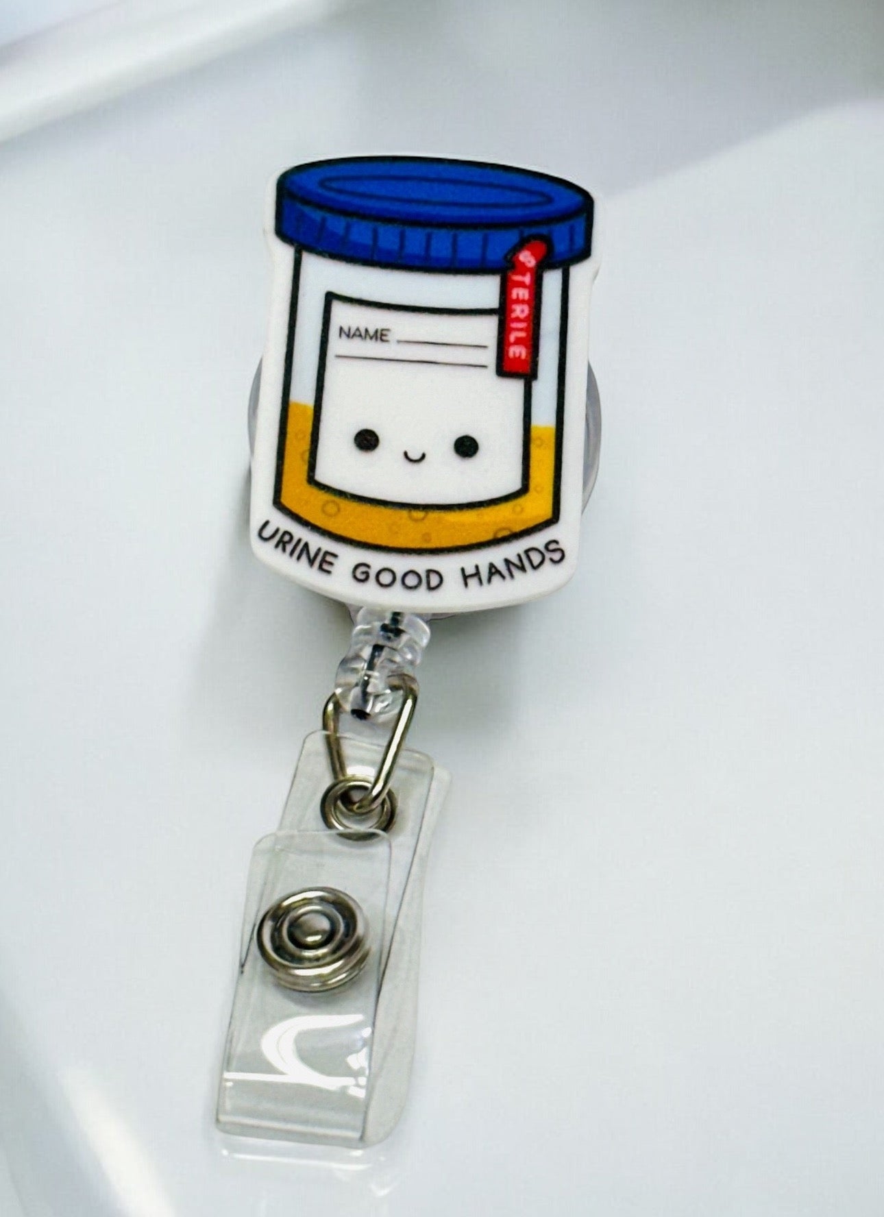 URINE IN GOOD HANDS BADGE REEL